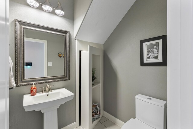 6203 Aspen Pass Dr, Kingwood, TX 77345 - half bath with toilet, tile patterned flooring, and baseboards