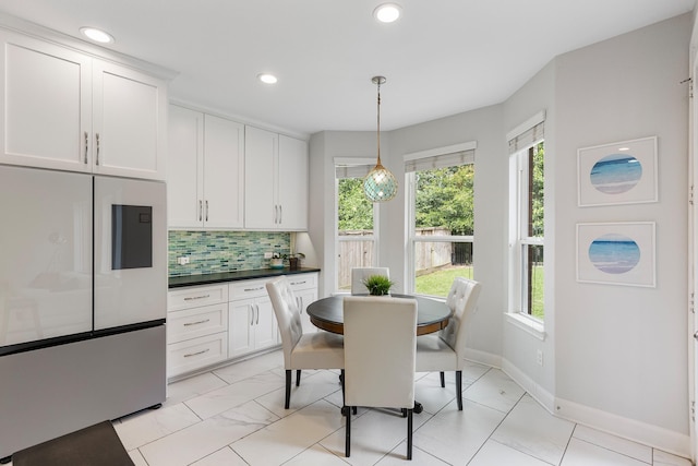 6203 Aspen Pass Dr, Kingwood, TX 77345 - dining area with plenty of natural light, baseboards, and recessed lighting