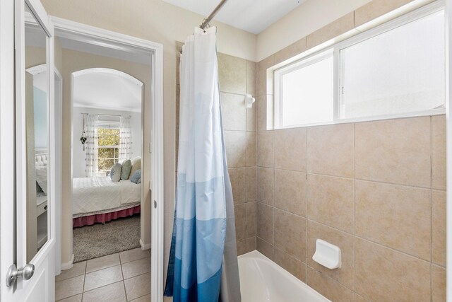 6203 Aspen Pass Dr, Kingwood, TX 77345 - bathroom featuring ensuite bathroom, tile patterned flooring, and shower / bath combination with curtain