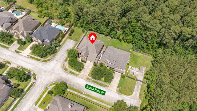 6203 Aspen Pass Dr, Kingwood, TX 77345 - aerial view of property's location featuring nearby suburban area and a forest