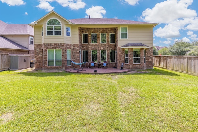 6203 Aspen Pass Dr, Kingwood, TX 77345 - rear view of property featuring a patio area and brick siding