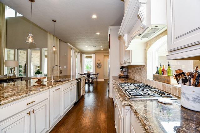 28011 Burnett Hills Ln, Fulshear, TX 77441 - kitchen with a sink, recessed lighting, stainless steel appliances, dark wood-style flooring, and stone counters
