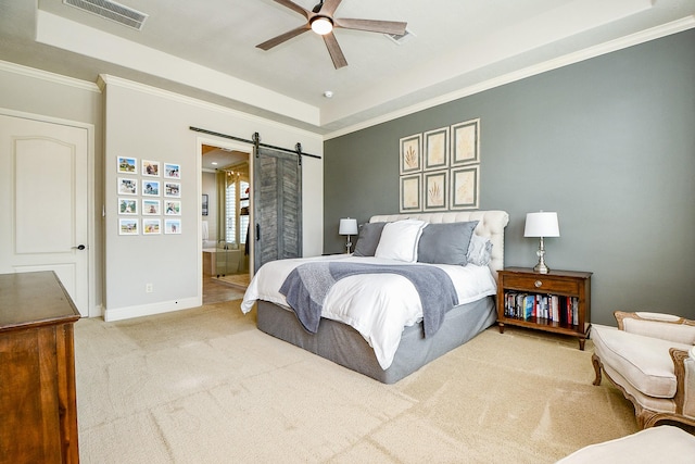 28011 Burnett Hills Ln, Fulshear, TX 77441 - bedroom with a tray ceiling, a barn door, carpet flooring, baseboards, and ornamental molding