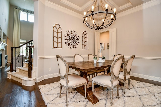 28011 Burnett Hills Ln, Fulshear, TX 77441 - dining area featuring stairway, a chandelier, wood finished floors, baseboards, and a towering ceiling
