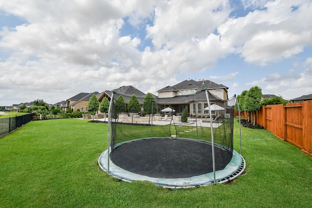 28011 Burnett Hills Ln, Fulshear, TX 77441 - view of yard featuring a trampoline and a residential view