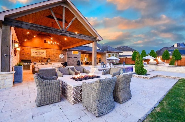 28011 Burnett Hills Ln, Fulshear, TX 77441 - view of patio featuring an outdoor kitchen and a fire pit