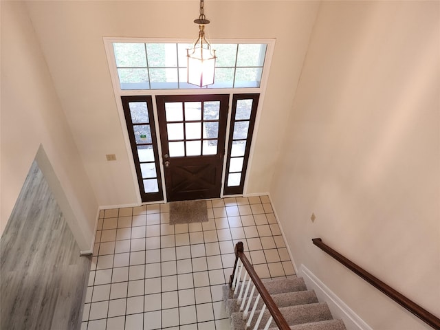3226 Country Club Blvd, Stafford, TX 77477 - tiled foyer entrance with baseboards, a towering ceiling, and stairs