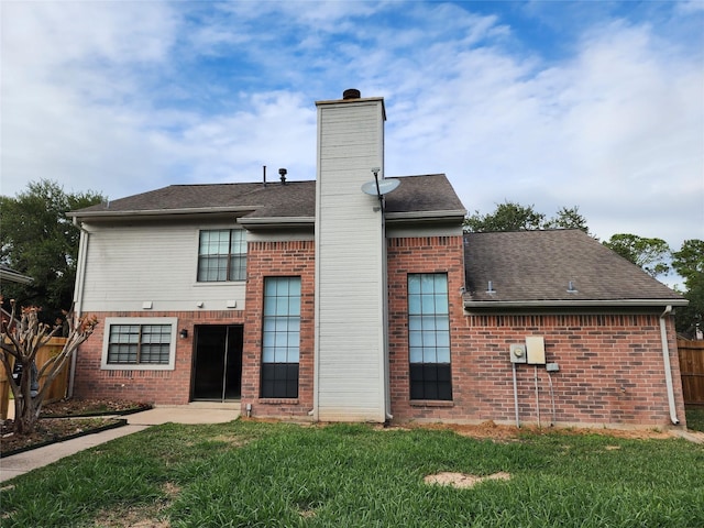 3226 Country Club Blvd, Stafford, TX 77477 - back of house featuring a chimney, brick siding, and roof with shingles