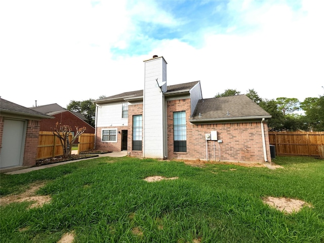 3226 Country Club Blvd, Stafford, TX 77477 - back of house featuring brick siding and a chimney