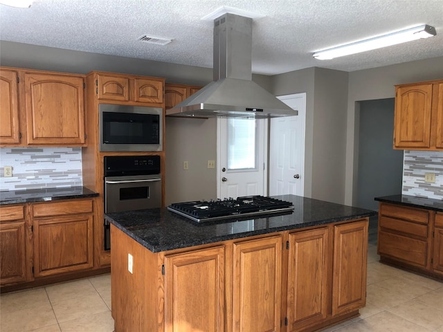 3226 Country Club Blvd, Stafford, TX 77477 - kitchen with stainless steel appliances, island exhaust hood, light tile patterned flooring, tasteful backsplash, and a center island