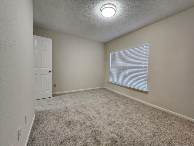3226 Country Club Blvd, Stafford, TX 77477 - carpeted empty room with a textured ceiling and baseboards