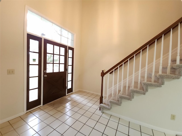 3226 Country Club Blvd, Stafford, TX 77477 - tiled entryway with baseboards, stairway, and a high ceiling