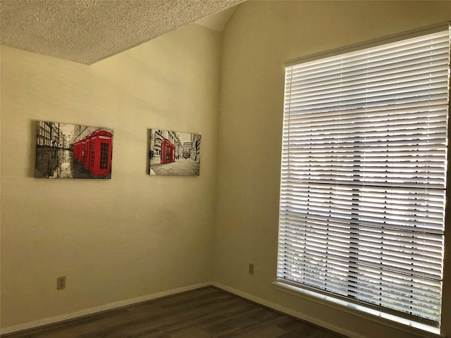 3226 Country Club Blvd, Stafford, TX 77477 - spare room with wood finished floors, baseboards, and a textured ceiling