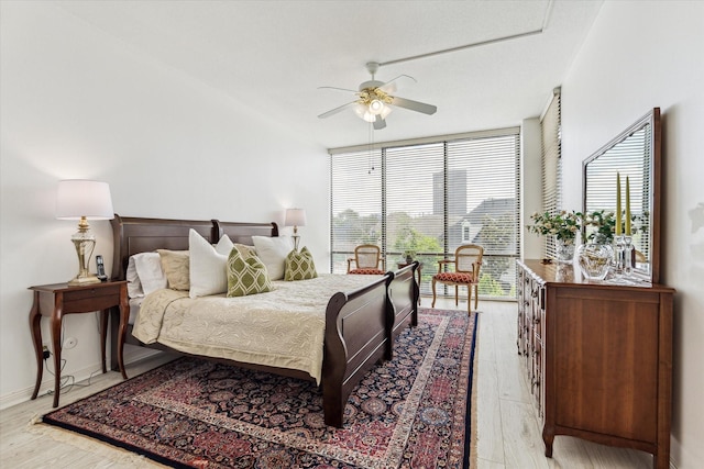 1111 Bering Dr Unit 301, Houston, TX 77057 - bedroom with light wood-style flooring and a ceiling fan