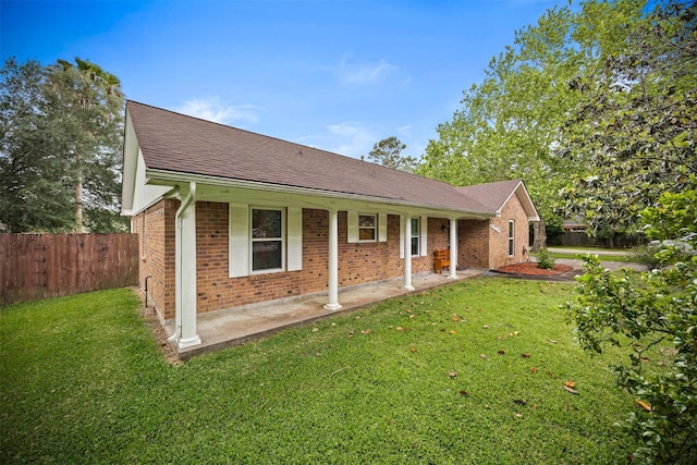 11855 23rd St, Santa Fe, TX 77510 - view of front facade with brick siding, a shingled roof, and a patio area
