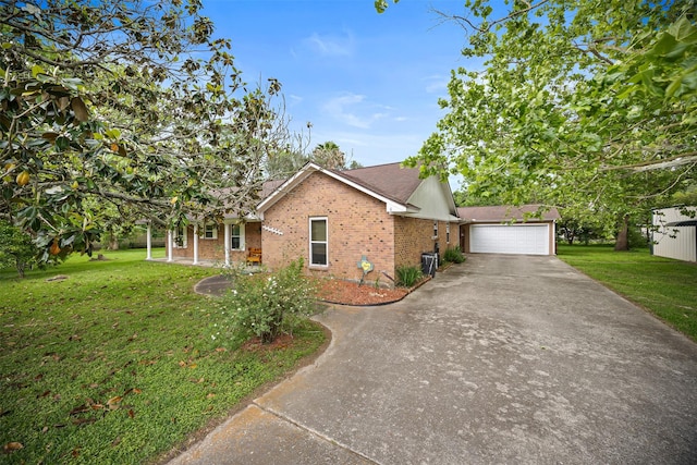 11855 23rd St, Santa Fe, TX 77510 - ranch-style house with brick siding, a front lawn, and cooling unit