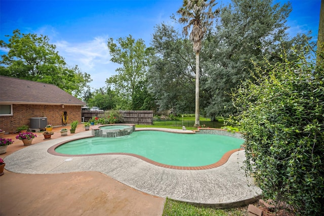 11855 23rd St, Santa Fe, TX 77510 - view of swimming pool with central AC unit, a patio area, a fenced backyard, and a pool with connected hot tub