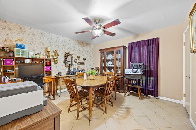 11855 23rd St, Santa Fe, TX 77510 - dining room featuring wallpapered walls, a ceiling fan, an accent wall, and light tile patterned flooring