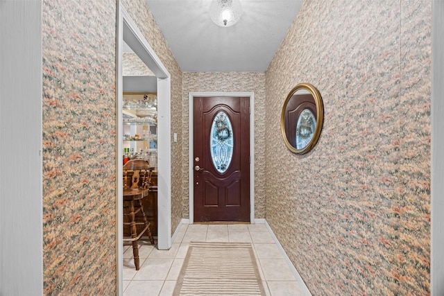 11855 23rd St, Santa Fe, TX 77510 - foyer entrance featuring light tile patterned floors and wallpapered walls