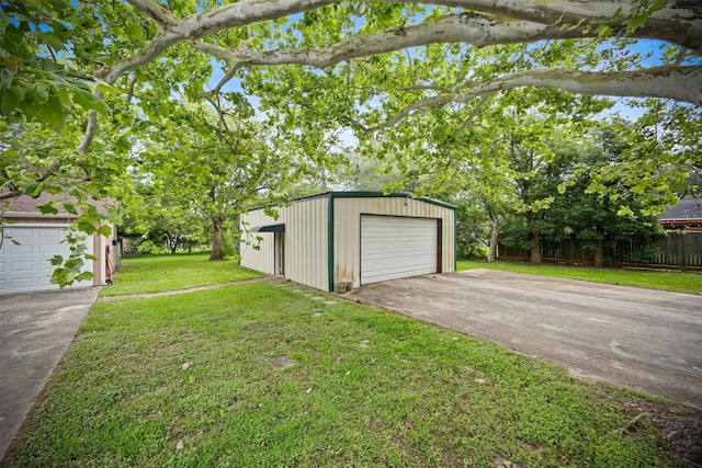 11855 23rd St, Santa Fe, TX 77510 - view of yard with an outdoor structure and a detached garage