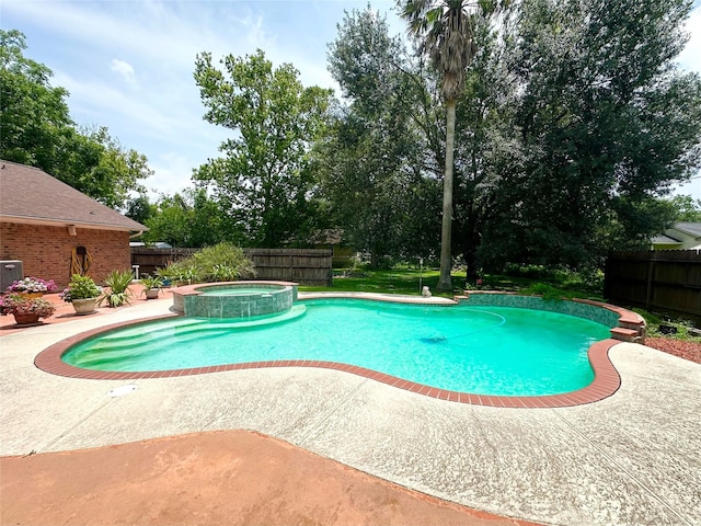 11855 23rd St, Santa Fe, TX 77510 - view of swimming pool with a patio area and a pool with connected hot tub