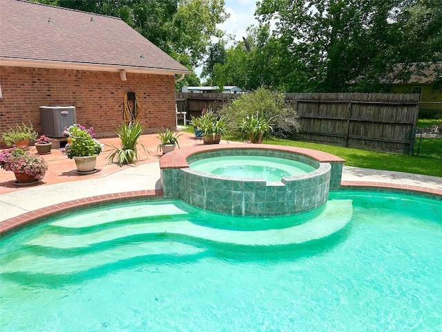 11855 23rd St, Santa Fe, TX 77510 - view of swimming pool with a pool with connected hot tub and a patio