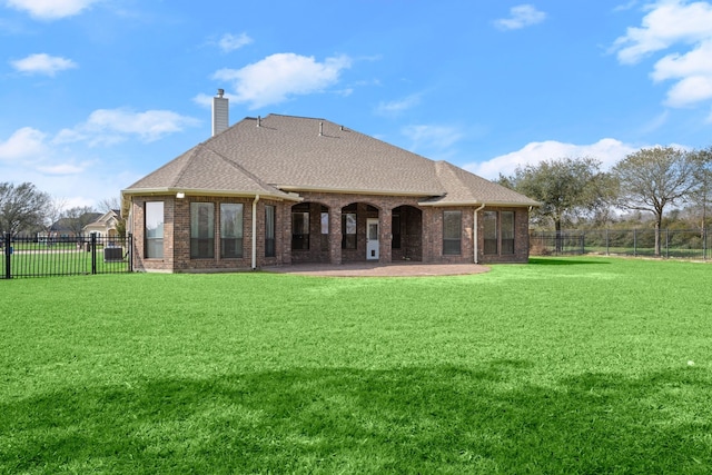 226 Beasley Reef Dr, Beach City, TX 77523 - back of house with a chimney, brick siding, and a shingled roof