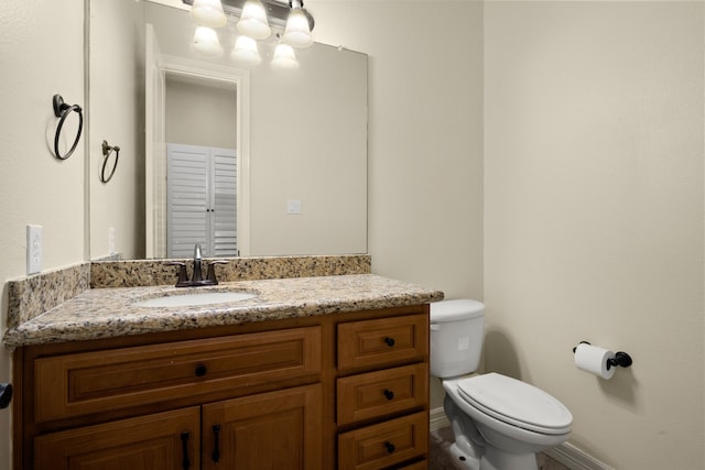 226 Beasley Reef Dr, Beach City, TX 77523 - bathroom with toilet, vanity, and baseboards
