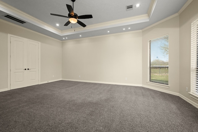 226 Beasley Reef Dr, Beach City, TX 77523 - spare room featuring a raised ceiling, ornamental molding, ceiling fan, dark carpet, and recessed lighting