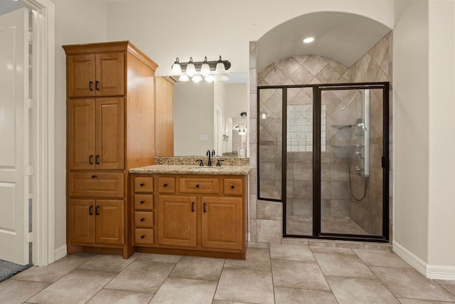 226 Beasley Reef Dr, Beach City, TX 77523 - bathroom with a shower stall, baseboards, and vanity