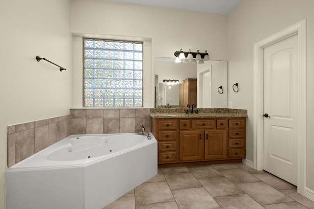 226 Beasley Reef Dr, Beach City, TX 77523 - bathroom with vanity, a tub with jets, and tile patterned floors