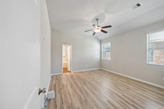 20511 Kendall Cliff Ct, Katy, TX 77449 - spare room featuring light wood-style floors, ceiling fan, and baseboards