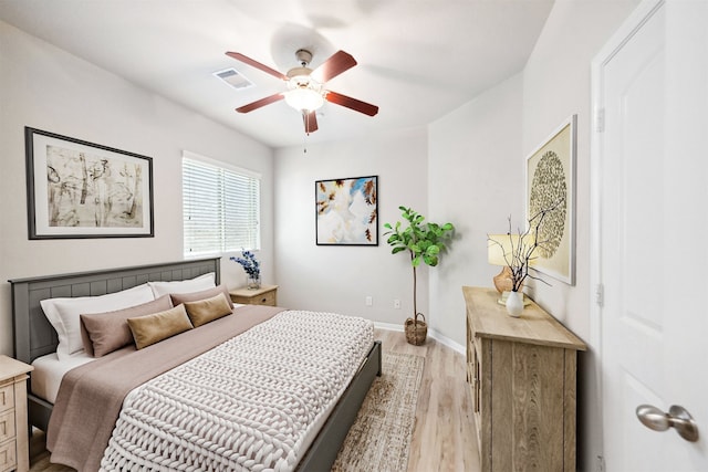 20511 Kendall Cliff Ct, Katy, TX 77449 - bedroom with light wood-style flooring, baseboards, and a ceiling fan