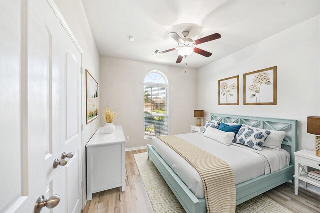 20511 Kendall Cliff Ct, Katy, TX 77449 - bedroom featuring light wood-style floors, a ceiling fan, and baseboards
