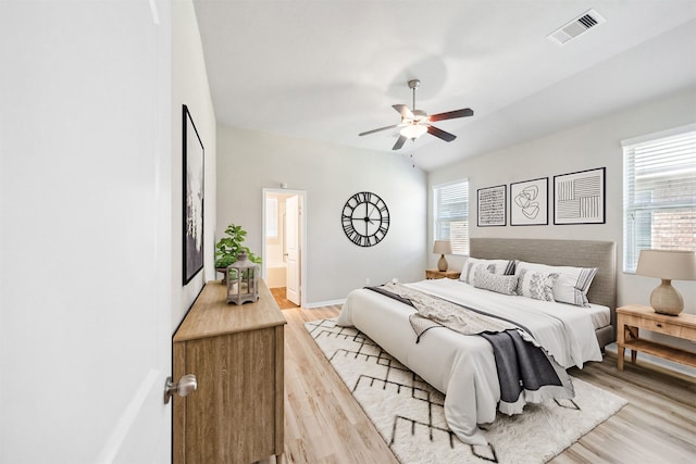20511 Kendall Cliff Ct, Katy, TX 77449 - bedroom featuring light wood-style flooring, ceiling fan, connected bathroom, and baseboards