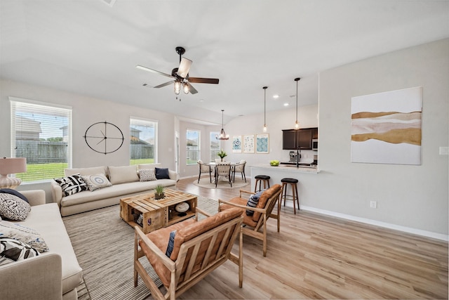 20511 Kendall Cliff Ct, Katy, TX 77449 - living area featuring light wood-type flooring, baseboards, a ceiling fan, and recessed lighting