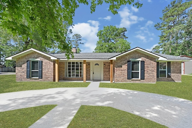 1903 Round Wind Trl, Crosby, TX 77532 - ranch-style home featuring a front lawn, brick siding, and a chimney