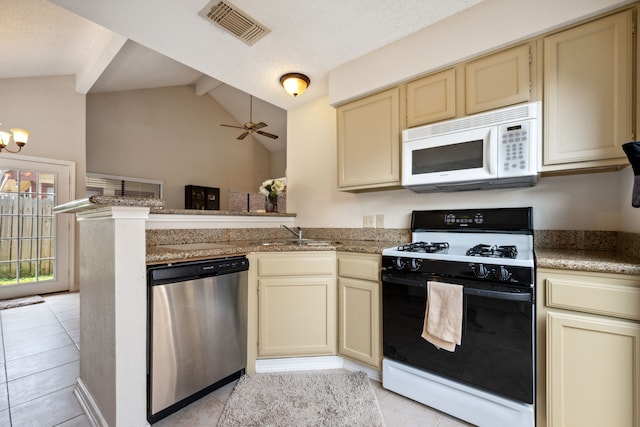 8621 Beechcrest St, Houston, TX 77083 - kitchen with white microwave, dishwasher, gas range oven, and cream cabinetry