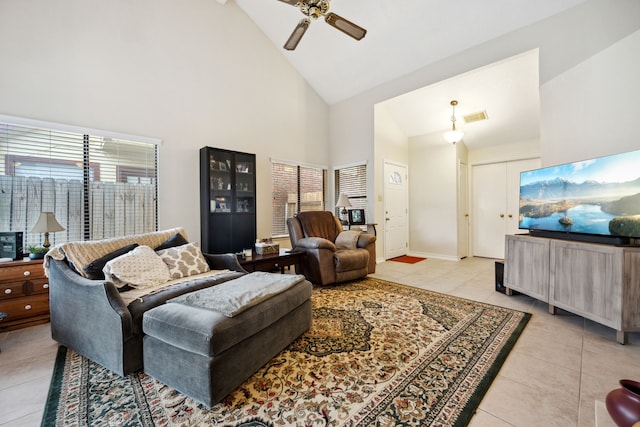 8621 Beechcrest St, Houston, TX 77083 - living room with light tile patterned floors, a ceiling fan, and high vaulted ceiling