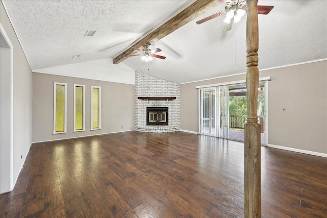 240 Berwick Dr, Bridge City, TX 77611 - unfurnished living room with a ceiling fan, wood finished floors, a brick fireplace, a textured ceiling, and baseboards