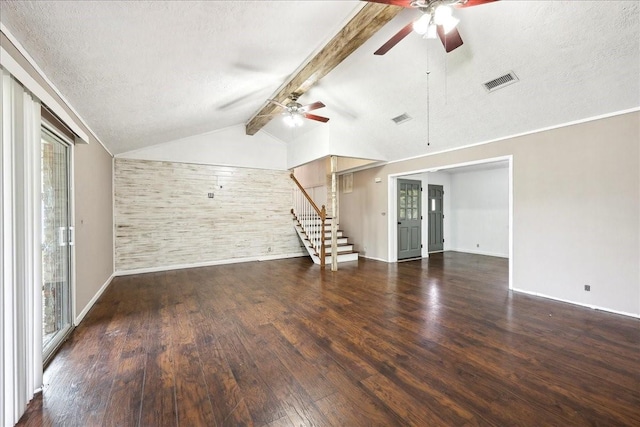 240 Berwick Dr, Bridge City, TX 77611 - unfurnished living room featuring ceiling fan, stairs, plenty of natural light, wood finished floors, and a textured ceiling