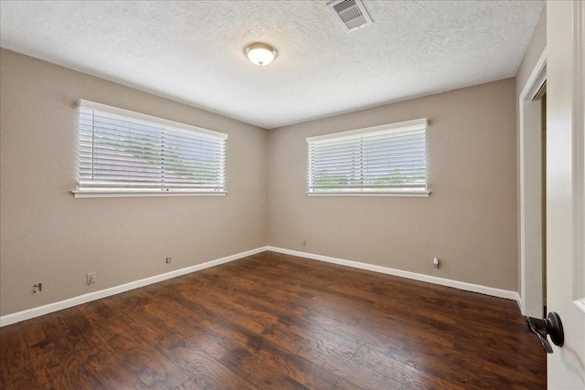 240 Berwick Dr, Bridge City, TX 77611 - unfurnished bedroom featuring wood finished floors, baseboards, a textured ceiling, and a closet