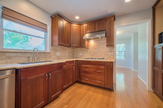 5243 Stillbrooke Dr, Houston, TX 77096 - kitchen with a sink, under cabinet range hood, stainless steel appliances, decorative backsplash, and recessed lighting