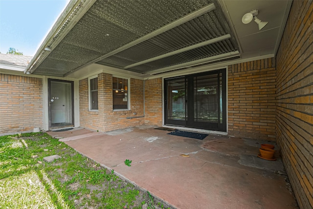 5243 Stillbrooke Dr, Houston, TX 77096 - property entrance with brick siding and a patio area