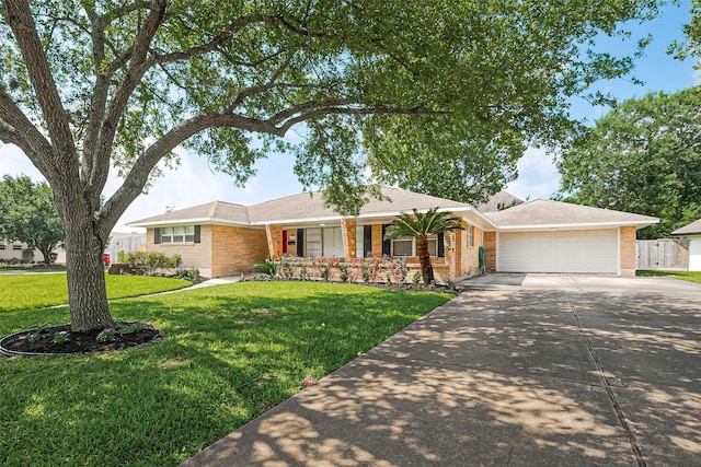 5243 Stillbrooke Dr, Houston, TX 77096 - ranch-style home featuring brick siding, concrete driveway, a porch, and a front yard