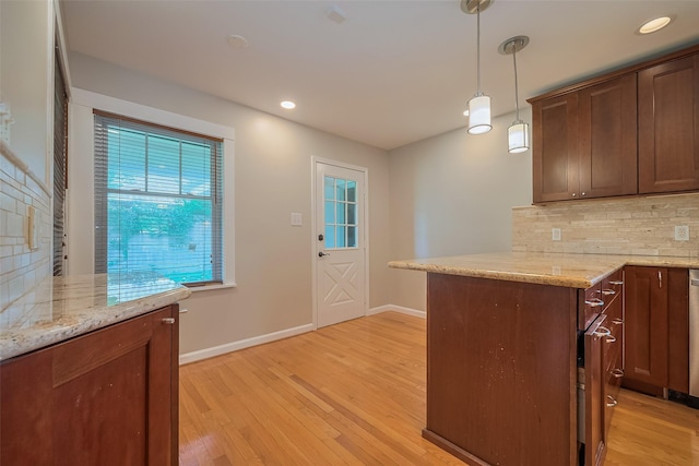 5243 Stillbrooke Dr, Houston, TX 77096 - kitchen with backsplash, light wood finished floors, baseboards, and recessed lighting