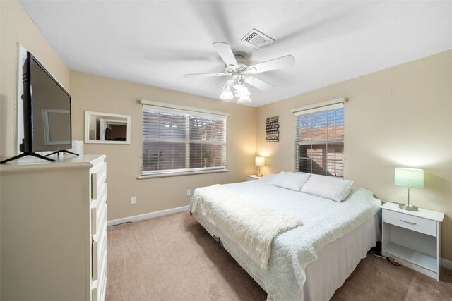 189 New Cove Dr, Livingston, TX 77351 - carpeted bedroom with baseboards and ceiling fan