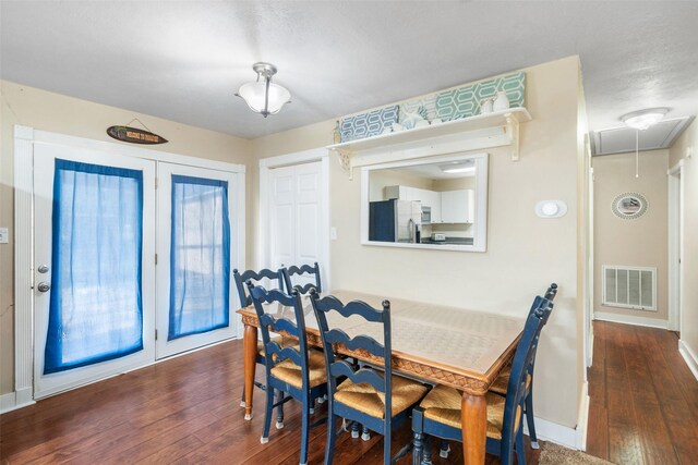 189 New Cove Dr, Livingston, TX 77351 - dining area featuring attic access, hardwood / wood-style flooring, and baseboards