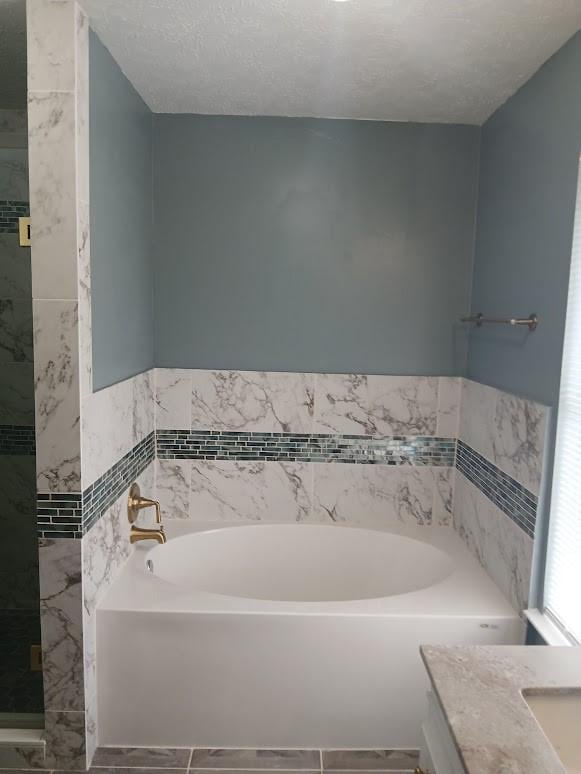 13523 La Concha Ln, Houston, TX 77083 - bathroom with a garden tub and vanity