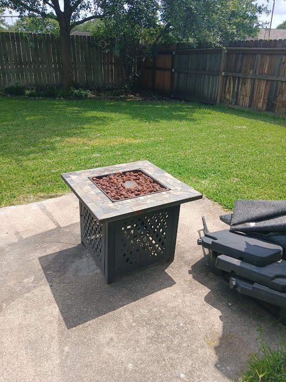 13523 La Concha Ln, Houston, TX 77083 - view of yard with a fire pit and a patio